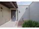 Outdoor entryway to home featuring desert landscaping, door, and lighting at 16807 E Gunsight Dr # B18, Fountain Hills, AZ 85268