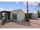 Inviting exterior with desert landscaping, a shaded patio, and well-maintained architecture with covered parking at 16807 E Gunsight Dr # B18, Fountain Hills, AZ 85268