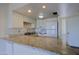 Well-lit kitchen features granite countertops, white cabinetry, and modern appliances at 16807 E Gunsight Dr # B18, Fountain Hills, AZ 85268