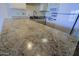 A close up of the beautiful granite countertops, sink and appliances in the kitchen at 16807 E Gunsight Dr # B18, Fountain Hills, AZ 85268