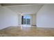 Living room with tiled flooring and natural light that leads to a kitchen and balcony at 16807 E Gunsight Dr # B18, Fountain Hills, AZ 85268