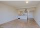 Open-concept living area leading to a white kitchen with ample counter space and tiled floor at 16807 E Gunsight Dr # B18, Fountain Hills, AZ 85268