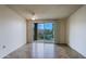 Bright living room with sliding glass doors offering scenic views and tiled floors at 16807 E Gunsight Dr # B18, Fountain Hills, AZ 85268