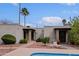 Pool with lounge chair and desert landscaping surrounding the community at 16807 E Gunsight Dr # B18, Fountain Hills, AZ 85268