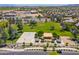 Aerial view of community park with basketball court and covered picnic, surrounded by lush landscaping in residential area at 16939 W Marconi Ave, Surprise, AZ 85388