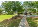 Scenic view of a community park with walking paths, playground structures, and shade trees for a tranquil atmosphere at 16939 W Marconi Ave, Surprise, AZ 85388