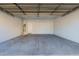 Spacious two car garage with water heater and door leading to inside at 16939 W Marconi Ave, Surprise, AZ 85388