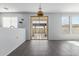 Bright living room overlooking the backyard with a sliding glass door and gray tile flooring at 16939 W Marconi Ave, Surprise, AZ 85388