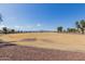 Expansive park area with mountain views and clear blue sky at 16939 W Marconi Ave, Surprise, AZ 85388