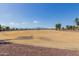 A wide shot of the community park and walking path with mountains in the background at 16939 W Marconi Ave, Surprise, AZ 85388