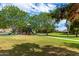 Community playground features climbing structures and slides for surrounded by lush green spaces and walkways at 16939 W Marconi Ave, Surprise, AZ 85388