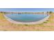 Large pond with water feature surrounded by a grassy area at 16939 W Marconi Ave, Surprise, AZ 85388