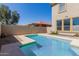 Beautiful view of the pool and yard with privacy fence at 16939 W Marconi Ave, Surprise, AZ 85388