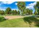 Beautiful community volleyball court with a gazebo and seating area, ideal for outdoor activities and relaxation at 16939 W Marconi Ave, Surprise, AZ 85388