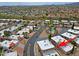 Community aerial view highlighting the home with nearby pool and lush green landscaping at 17031 E Calle Del Oro -- # B, Fountain Hills, AZ 85268