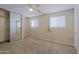 Bedroom with mirrored closet, ceiling fan, and neutral carpeting at 17031 E Calle Del Oro -- # B, Fountain Hills, AZ 85268