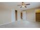 Bedroom featuring carpet, ceiling fan, closet, and hallway access at 17056 E Calle Del Oro Dr # B, Fountain Hills, AZ 85268