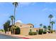 Stylish two-story townhouse featuring desert landscaping, mature palm trees, and private front patios at 17056 E Calle Del Oro Dr # B, Fountain Hills, AZ 85268