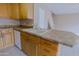 Kitchen view featuring laminated countertops and light cabinets with views to the living area and stairs at 17056 E Calle Del Oro Dr # B, Fountain Hills, AZ 85268