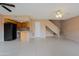 Open-concept living area with tile flooring flowing into the kitchen and up the stairs at 17056 E Calle Del Oro Dr # B, Fountain Hills, AZ 85268