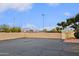 Expansive parking area framed by a low brick wall with light posts and desert landscaping beyond at 17056 E Calle Del Oro Dr # B, Fountain Hills, AZ 85268