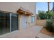 Private front patio with pavers, security door, and sliding glass door access to the interior at 17056 E Calle Del Oro Dr # B, Fountain Hills, AZ 85268