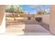 Enclosed backyard space featuring a patio and mature landscaping, perfect for outdoor living at 1715 E Branham Ln, Phoenix, AZ 85042