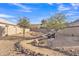 Backyard featuring a rock garden design, desert landscaping and a bench at 1715 E Branham Ln, Phoenix, AZ 85042