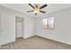 Comfortable bedroom featuring neutral walls, carpeting, and a window for natural light at 1715 E Branham Ln, Phoenix, AZ 85042