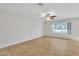 Bedroom with tile floor, natural light from the window, and a ceiling fan at 1715 E Branham Ln, Phoenix, AZ 85042