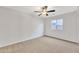 Neutral bedroom with a ceiling fan and a window, carpeted for added comfort at 1715 E Branham Ln, Phoenix, AZ 85042