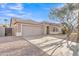 Inviting single-story home with a well-kept yard and a two-car garage on a sunny day at 1715 E Branham Ln, Phoenix, AZ 85042