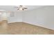 Bright living room with tile flooring, neutral walls, and a ceiling fan at 1715 E Branham Ln, Phoenix, AZ 85042