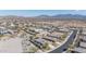 An aerial view of a desert neighborhood with stunning mountain views and multiple single-Gathering homes at 17796 W Sandy Rd, Goodyear, AZ 85338