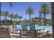 Enjoy the sunny days at the relaxing community pool with palm trees at 17796 W Sandy Rd, Goodyear, AZ 85338