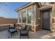 Inviting front porch with stone accents and outdoor seating area to enjoy the neighborhood at 17796 W Sandy Rd, Goodyear, AZ 85338