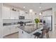 Well-appointed kitchen with stainless steel appliances, granite countertops and island seating at 17796 W Sandy Rd, Goodyear, AZ 85338