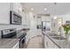 Modern kitchen with granite countertops, stainless steel appliances, and ample cabinet space at 17796 W Sandy Rd, Goodyear, AZ 85338