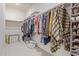 Walk-in closet featuring clothing racks, a shelf for shoes, and a laundry basket at 17796 W Sandy Rd, Goodyear, AZ 85338