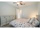 Bedroom featuring neutral paint, carpet flooring, and a dresser at 18385 W Devonshire Ave, Goodyear, AZ 85395