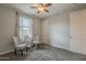 Bedroom featuring neutral paint, carpet flooring, a ceiling fan, and window with natural light at 18385 W Devonshire Ave, Goodyear, AZ 85395