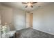 Bedroom featuring neutral paint, a ceiling fan, and a chair at 18385 W Devonshire Ave, Goodyear, AZ 85395