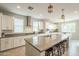 Open kitchen featuring a central island with seating, stainless appliances, and recessed lighting at 18385 W Devonshire Ave, Goodyear, AZ 85395