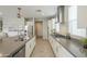 Spacious kitchen featuring a central island, stainless appliances, recessed lighting, and gray countertops at 18385 W Devonshire Ave, Goodyear, AZ 85395