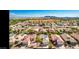 Aerial view of a vibrant community with well-maintained homes and stunning mountain views at 1869 E Birch St, Casa Grande, AZ 85122