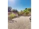 Low-maintenance backyard with desert landscaping and a block fence providing privacy at 1869 E Birch St, Casa Grande, AZ 85122