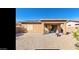 Spacious backyard featuring a covered patio, low-maintenance gravel, and clear blue skies at 1869 E Birch St, Casa Grande, AZ 85122