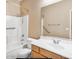 Bathroom with tub, shower, grab bars, and vanity at 1869 E Birch St, Casa Grande, AZ 85122