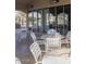 Community Patio Area with tables, chairs, and views of trees and adjacent homes at 1869 E Birch St, Casa Grande, AZ 85122