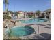 Community pool and hot tub with ample seating and lush landscaping at 1869 E Birch St, Casa Grande, AZ 85122